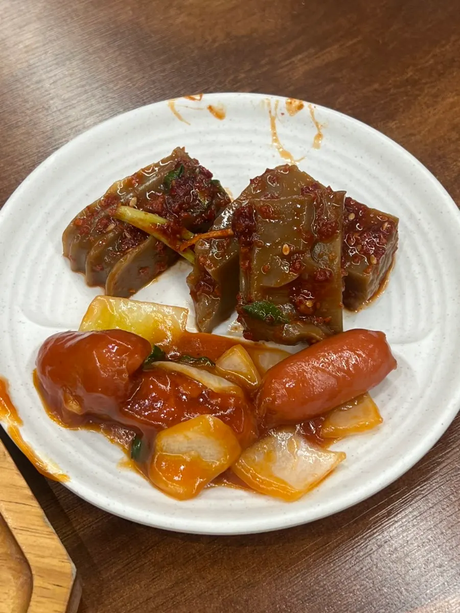 Table spread with tteokgalbi, rice, and soup