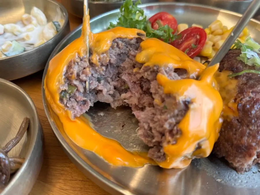 Cheese tteokgalbi topped generously with cheddar cheese