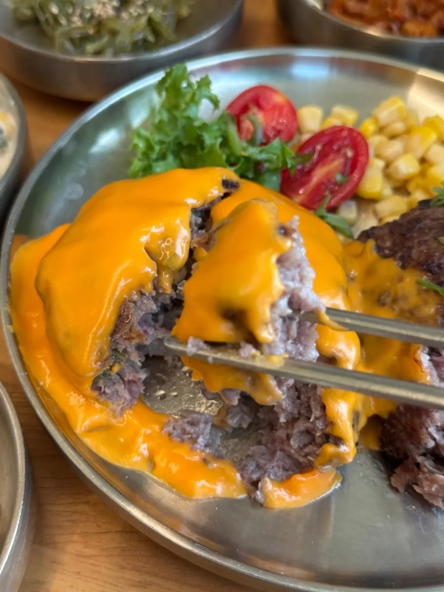 Cheese tteokgalbi picked up with melted cheese