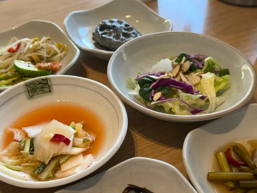 Several side dishes laid out on the table