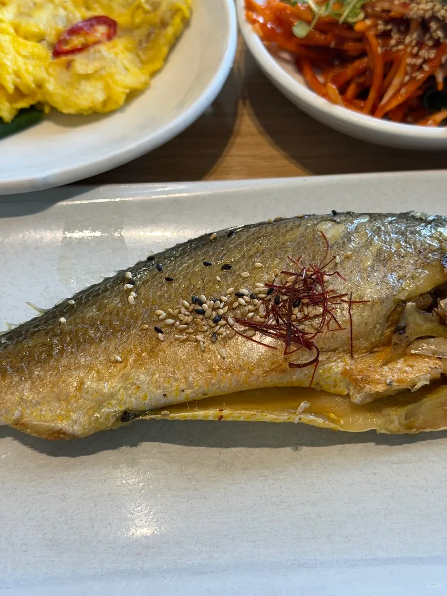 Grilled dried corvina on a plate