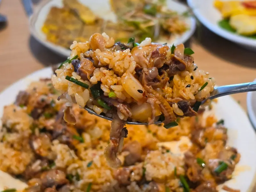 The generous cockle bibimbap alongside the extra bowl of rice