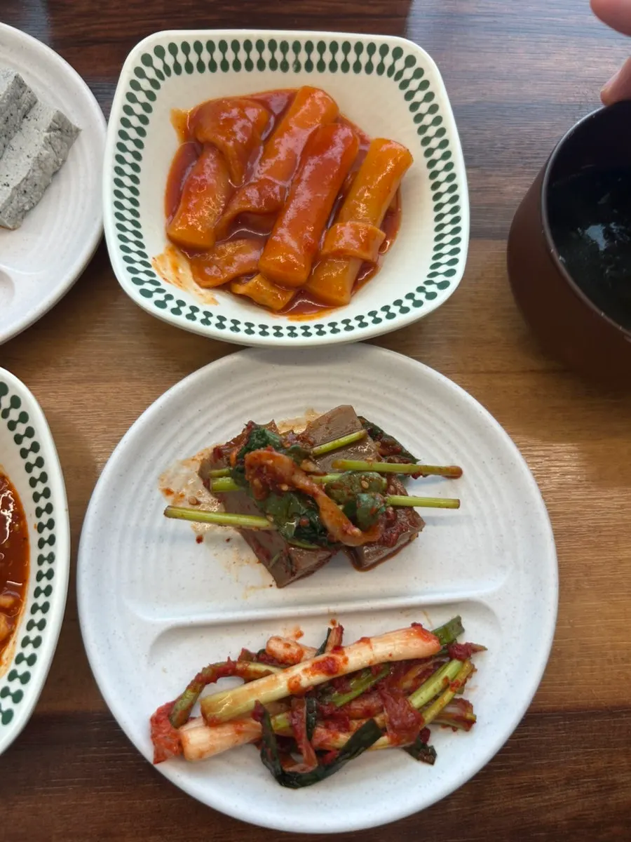 A full plate of side dishes gathered from the self-serve corner