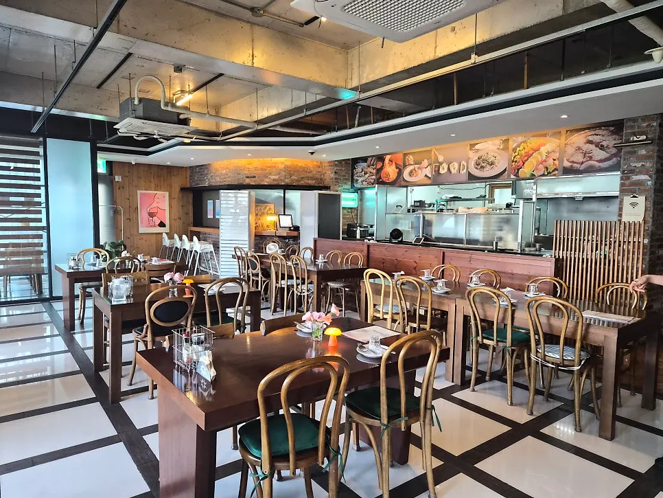 Riverside's interior with ocean views through floor-to-ceiling windows