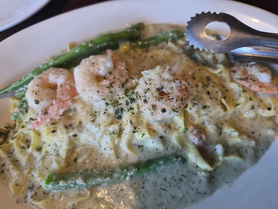Abalone risotto topped with a large piece of abalone