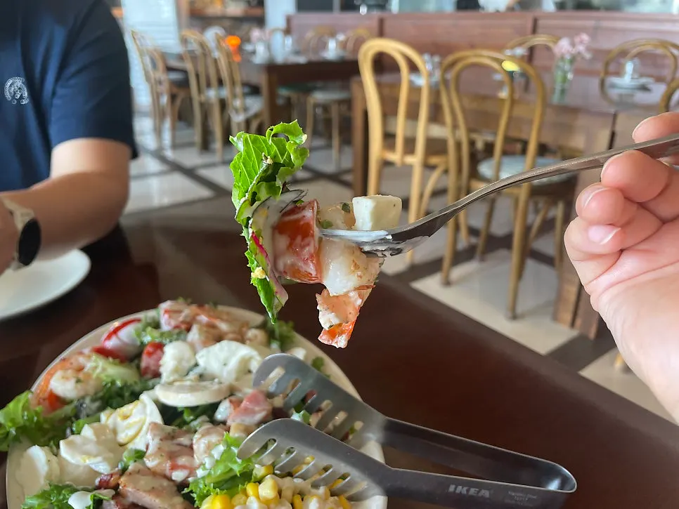 Cobb salad with tomato, shrimp, and corn