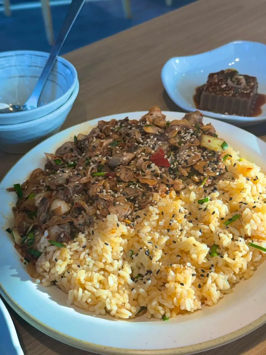 Bowl of cockle bibimbap piled with cockles