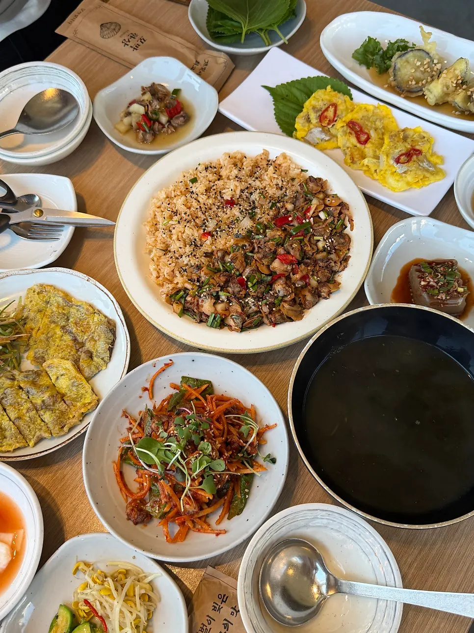 Cockle bibimbap and beef pancake set for two on the table
