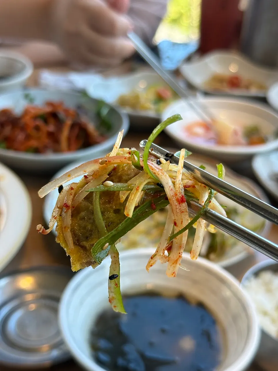 A bite of beef pancake wrapped in lettuce