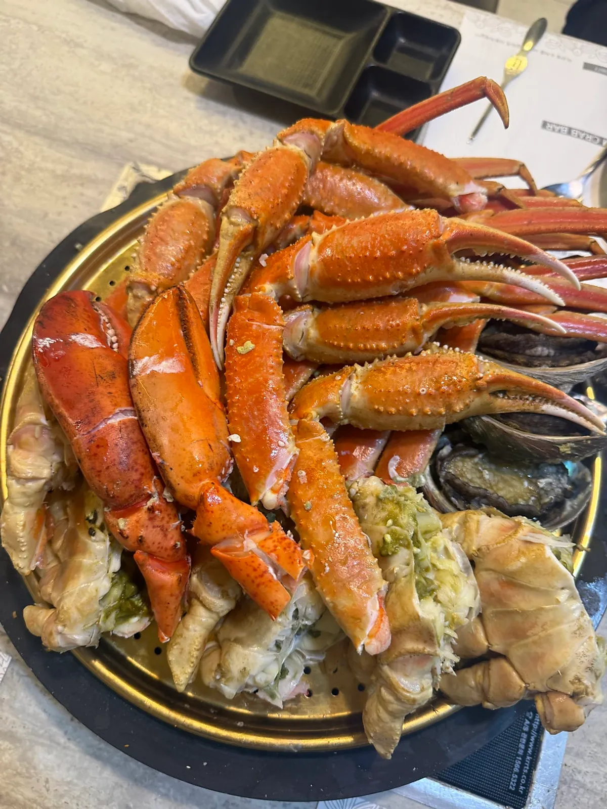 A huge plate piled with cleaned snow crab