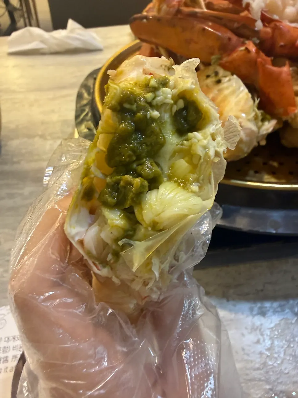 Crab meat dipped in mustard-based sauce