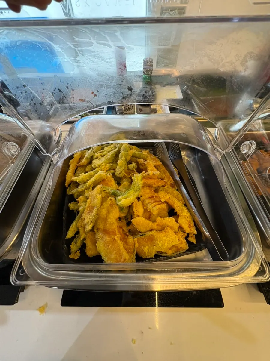 Various side dishes laid out at the self-serve bar