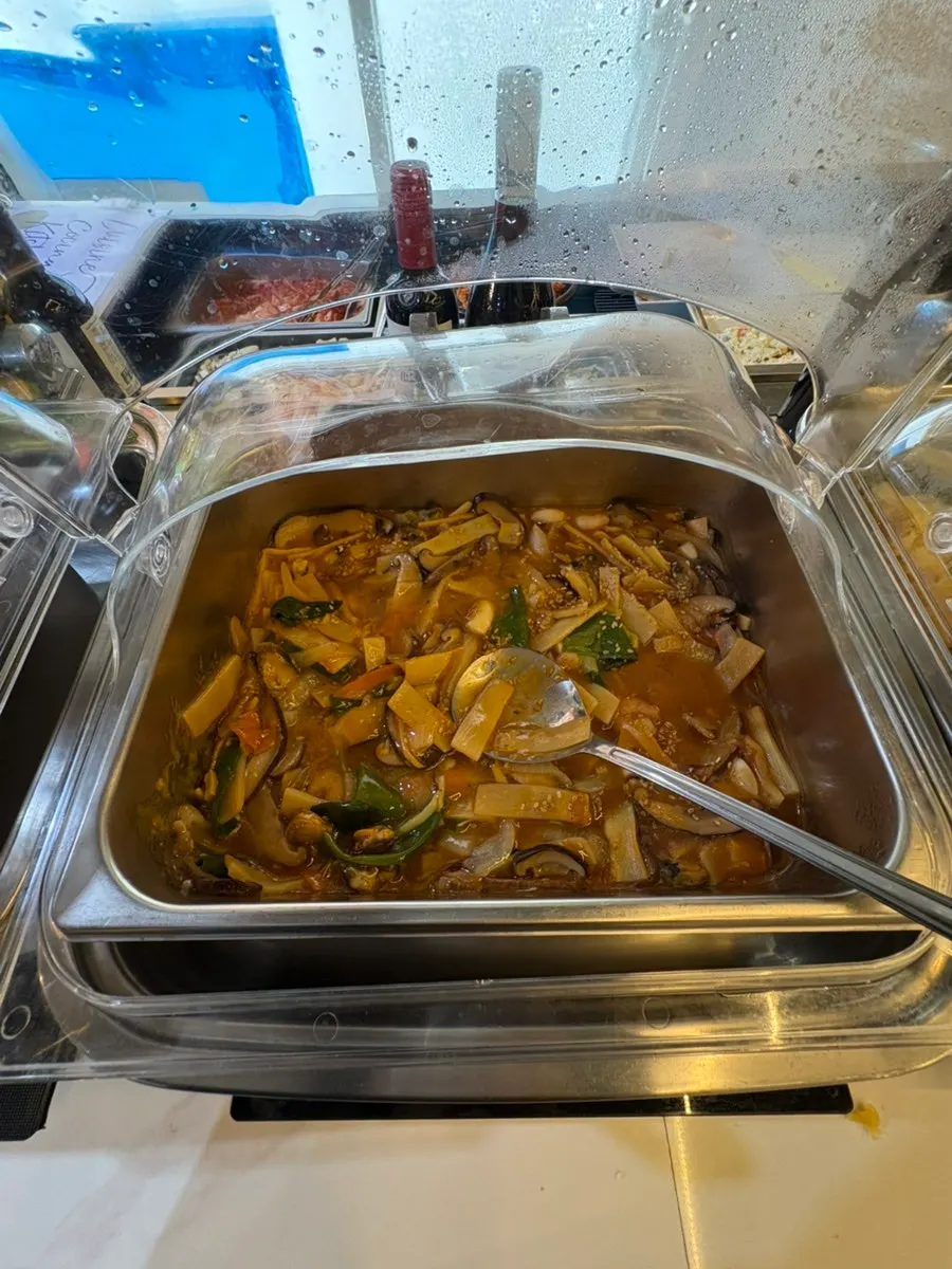 Fried items and basic side dishes displayed at the self-serve bar