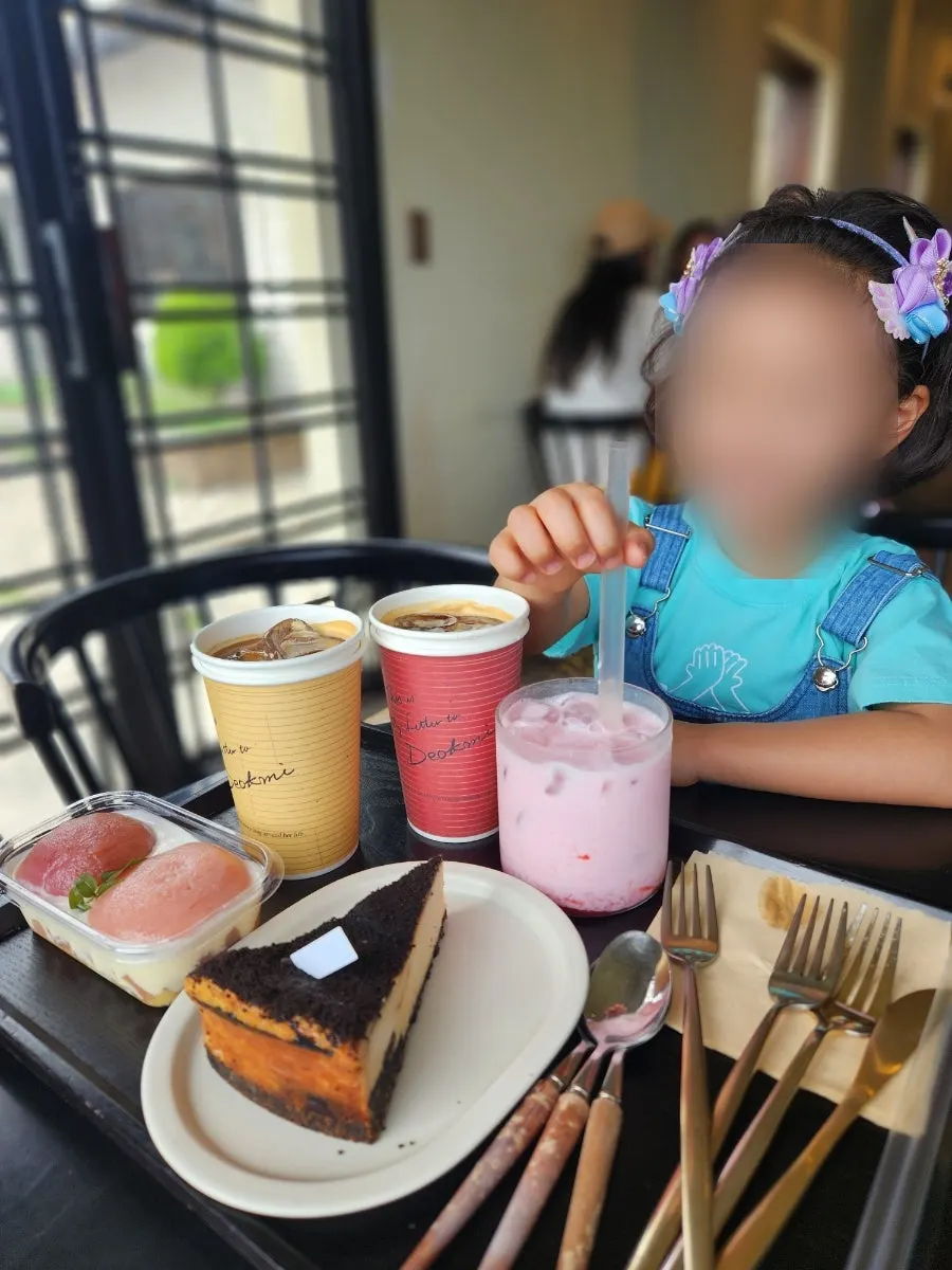 Vertical photo of the dessert showcase at Deokmi Gijang Branch