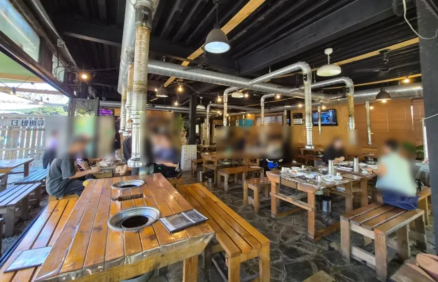Interior of The Barbecue 051 with wooden tables