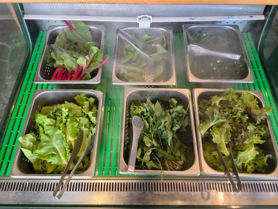 Various ssam vegetables prepared at the self-service bar
