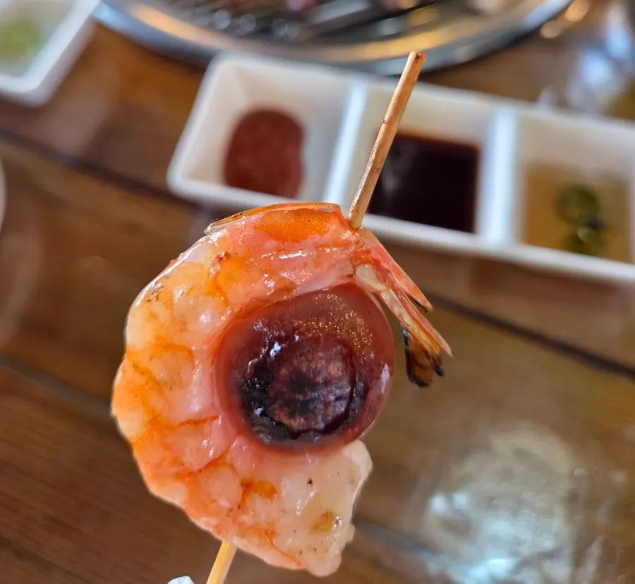 Various handmade skewers on the grill