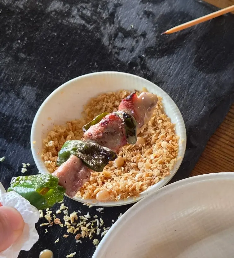 Handmade skewers served with peanut sauce and breadcrumbs
