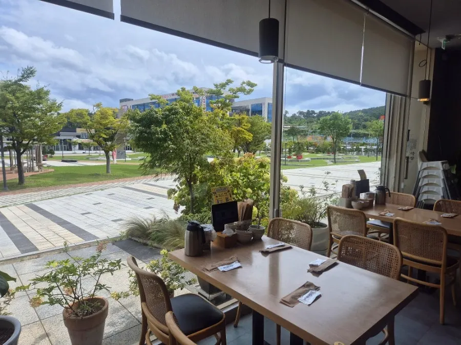 Spacious dining hall with tables inside the restaurant