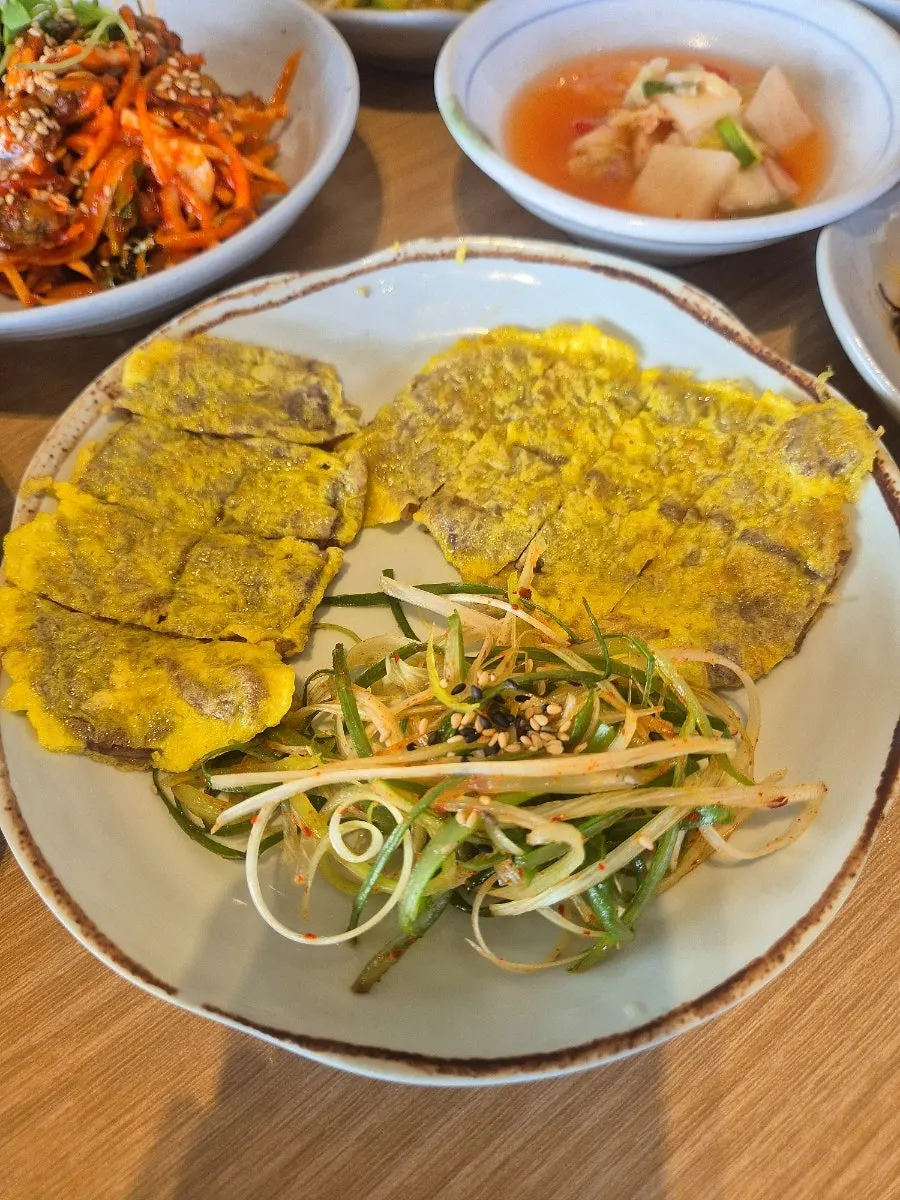 A large bowl filled with fish seaweed soup