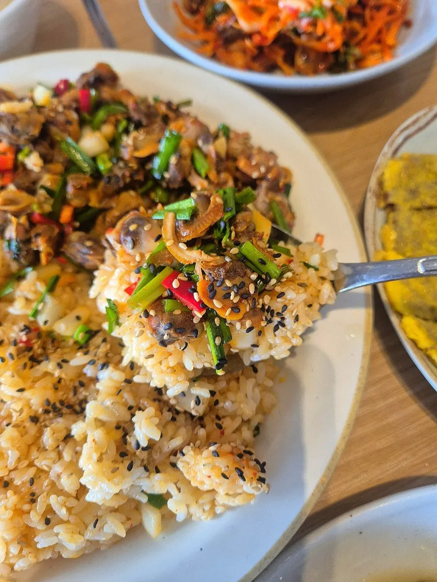Cockle bibimbap generously topped with cockles