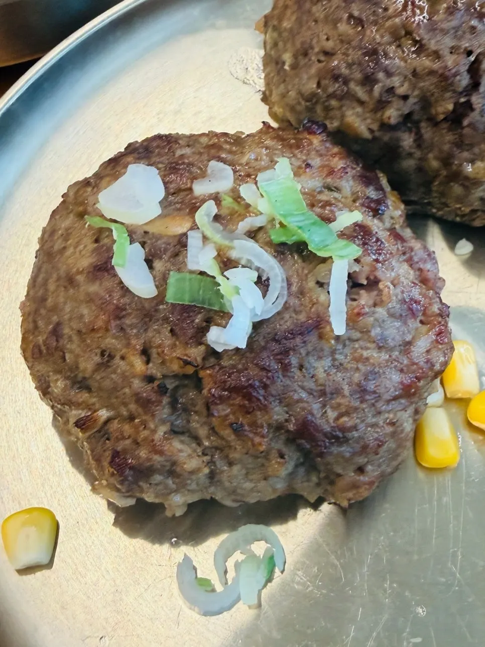 Hanwoo tteokgalbi dipped in sauce
