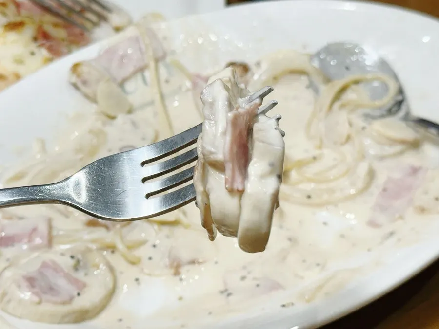 Close-up of carbonara with bacon and mushroom