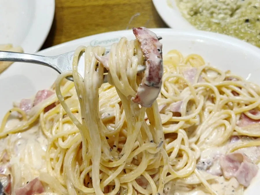 Carbonara served onto a plate