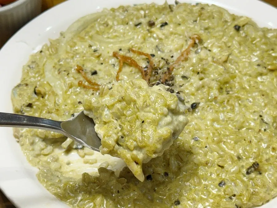 Close-up of risotto with abalone and clam meat