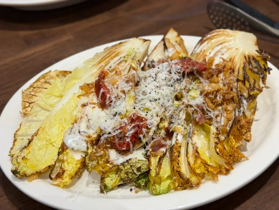 A plate of Bueokgan's napa cabbage Caesar salad