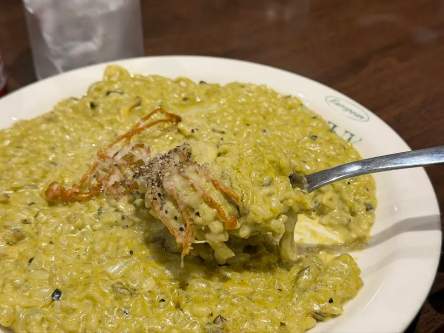 Abalone cream risotto topped with fried enoki mushrooms