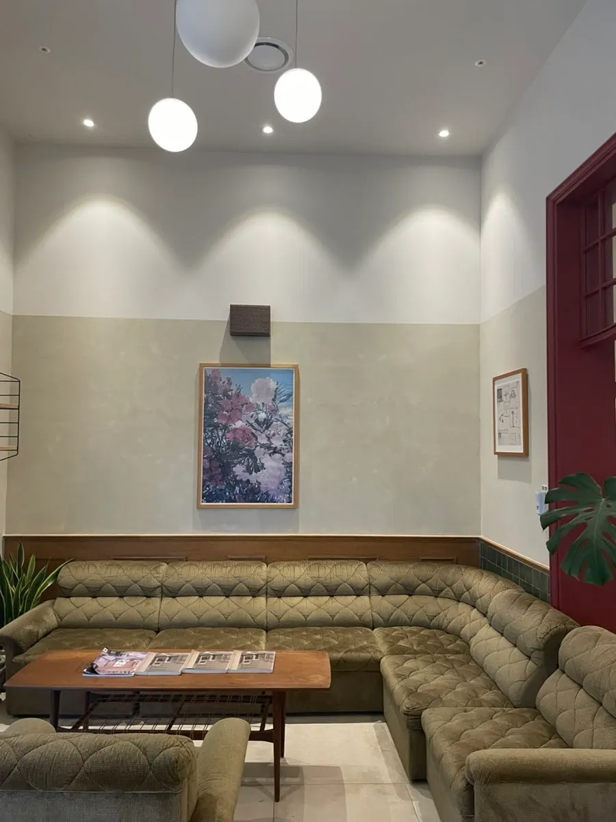 Bueokgan hall seating with wall frames and cozy lighting