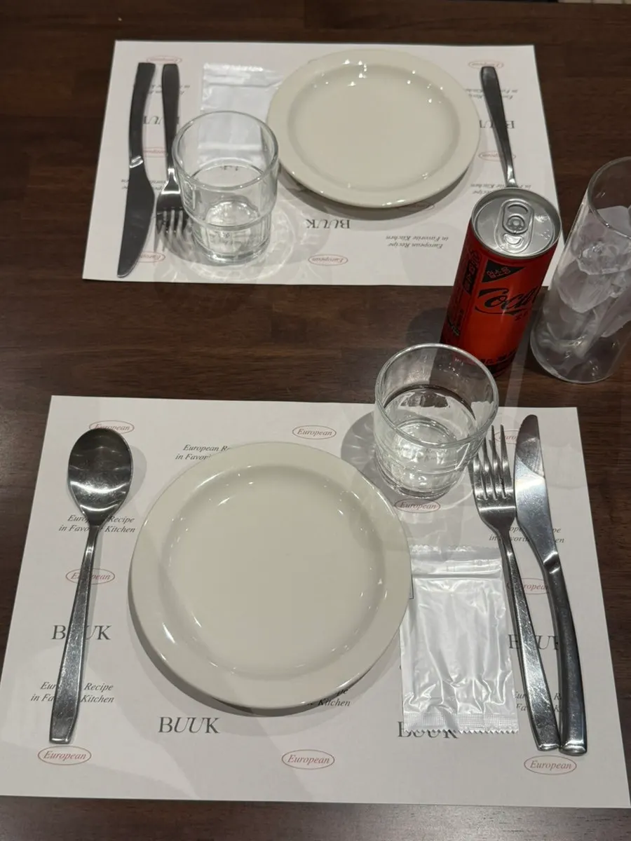 Pizza and pasta table setting ordered at Bueokgan