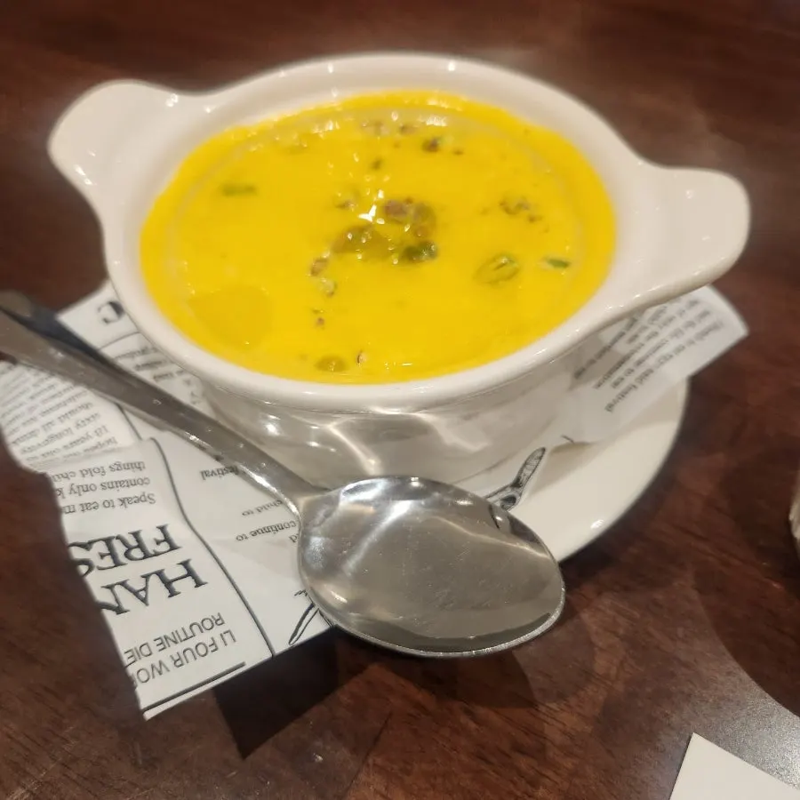 Sweet pumpkin soup served before the meal