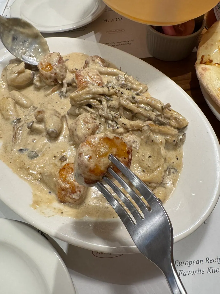 Truffle gnocchi with mushrooms and cream sauce