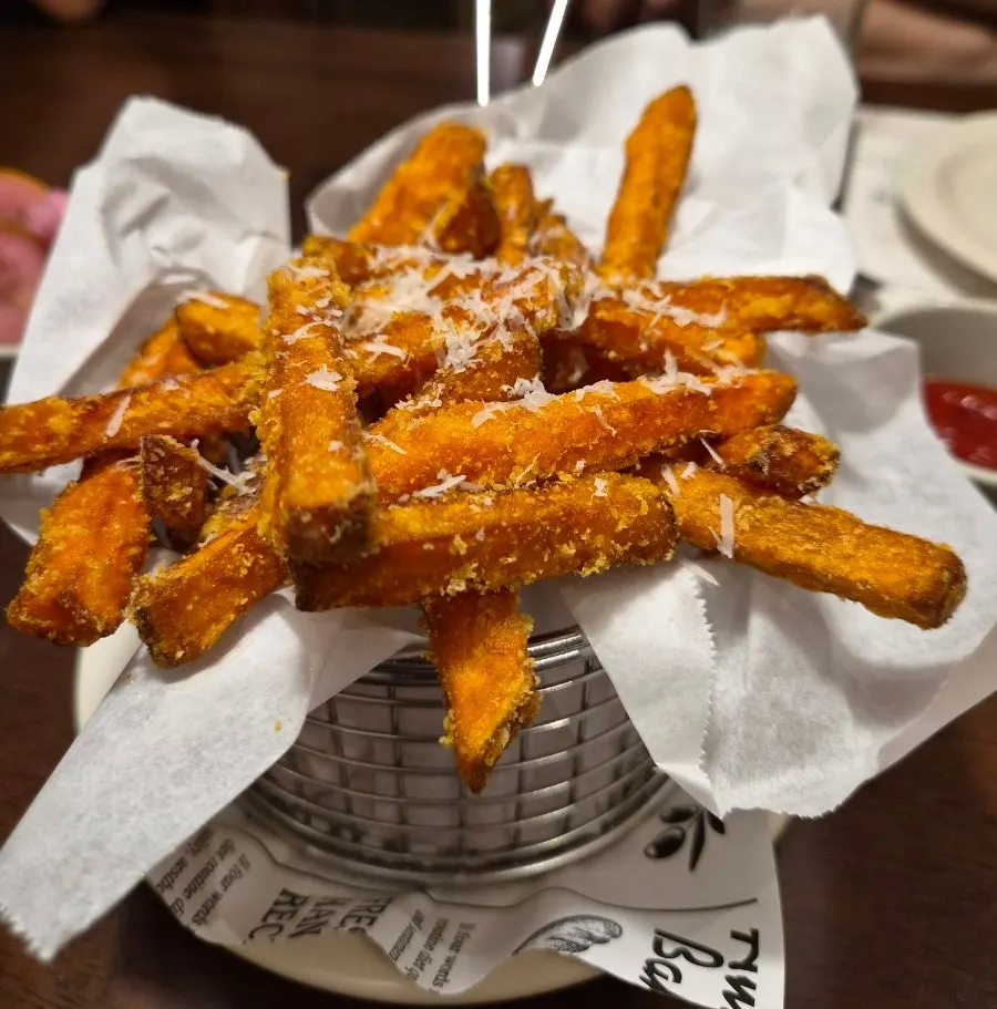 A plate of rice-flour-coated sweet potato fries