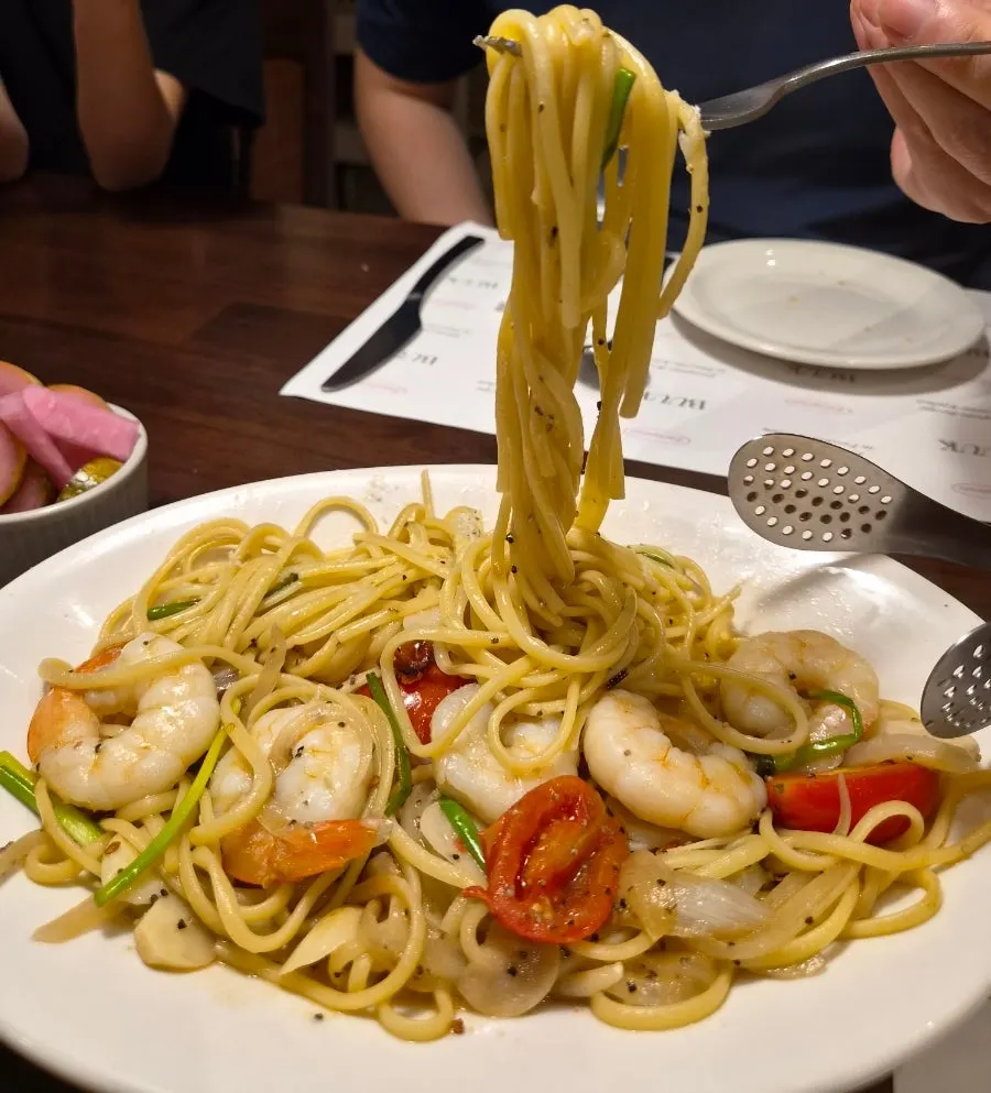 A generous portion of shrimp anchovy oil pasta