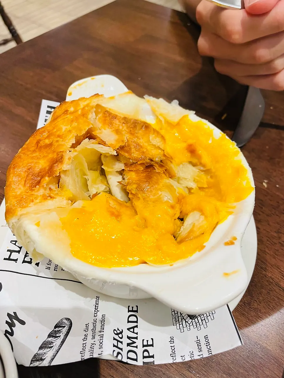 Dipping the pastry into the sweet pumpkin soup