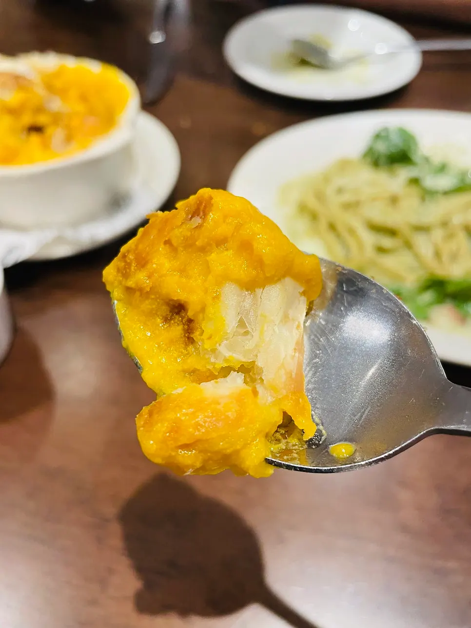 Warm sweet pumpkin soup under the pastry
