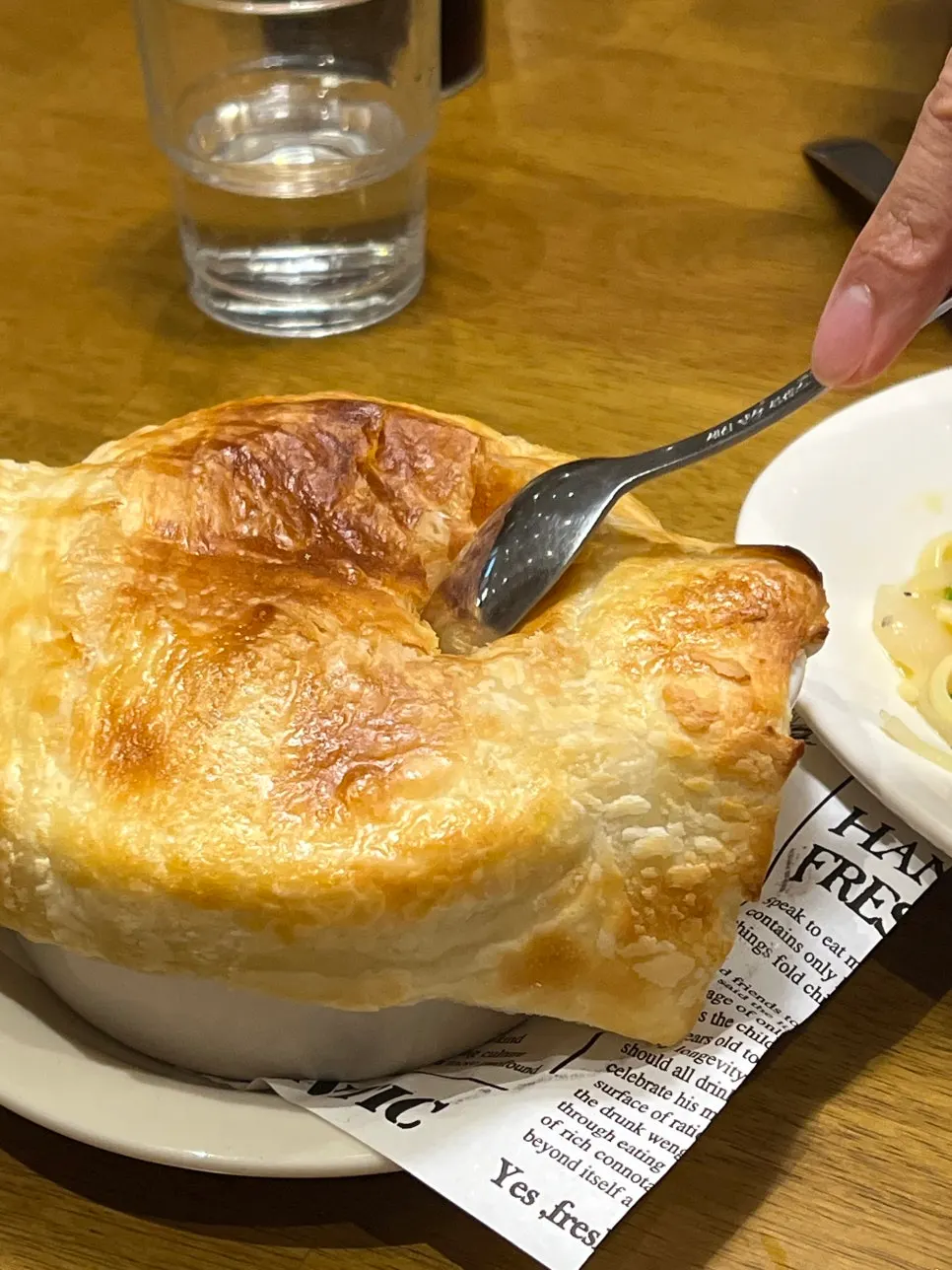 Pastry-topped sweet pumpkin soup