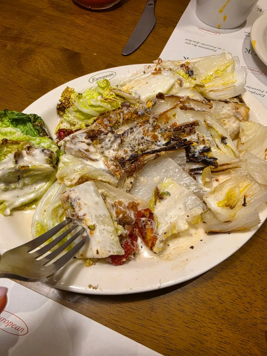 A bite of albaechu with Caesar dressing