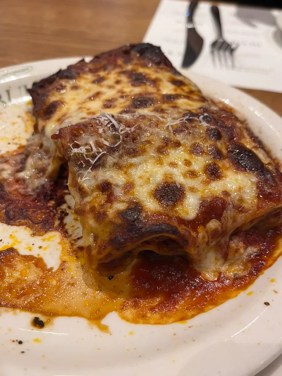 A spoonful scooped from the lasagna