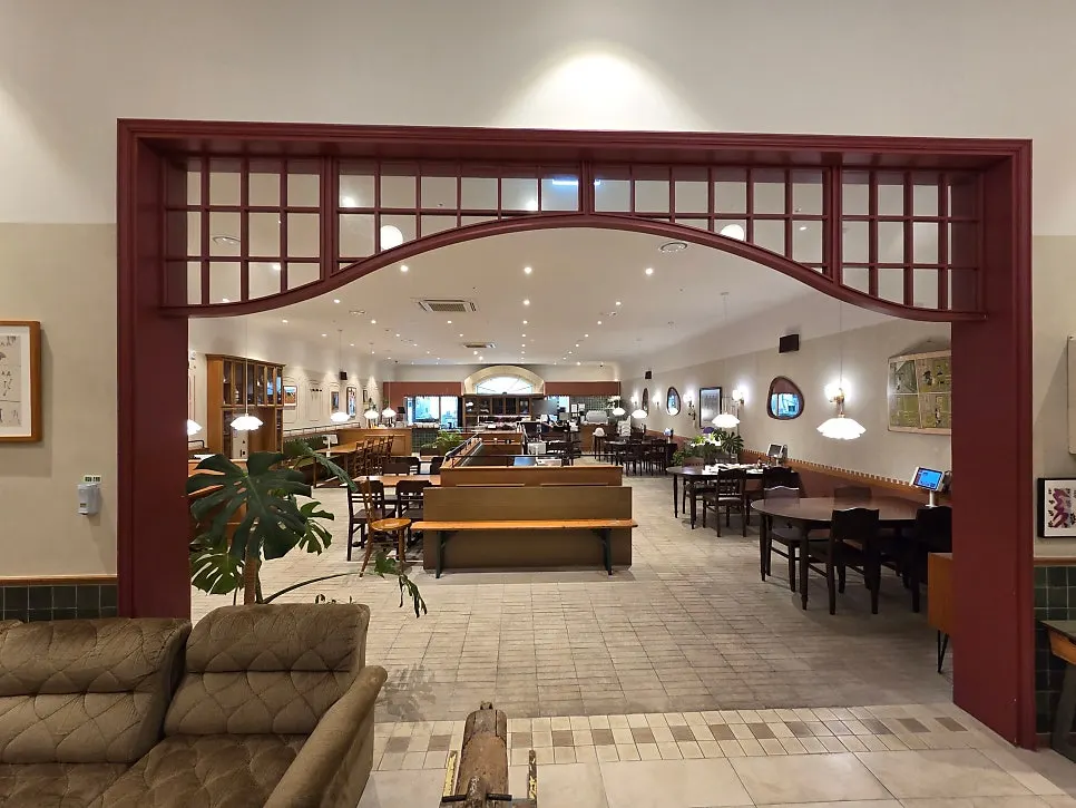 Restaurant interior with wood tones and lighting