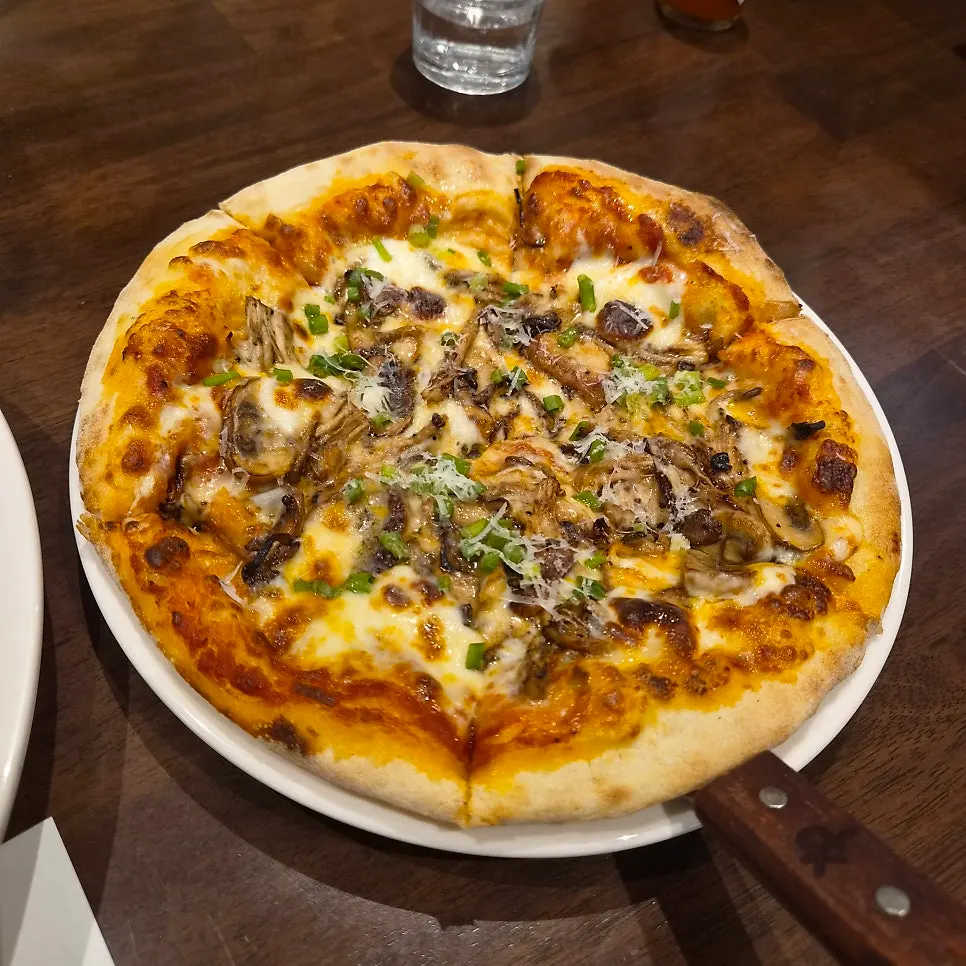 Truffle mushroom pizza generously topped with mushrooms