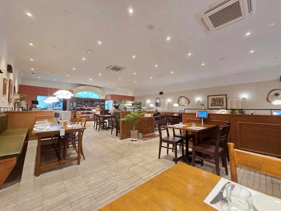 European-style interior with wood furniture and brick finishes