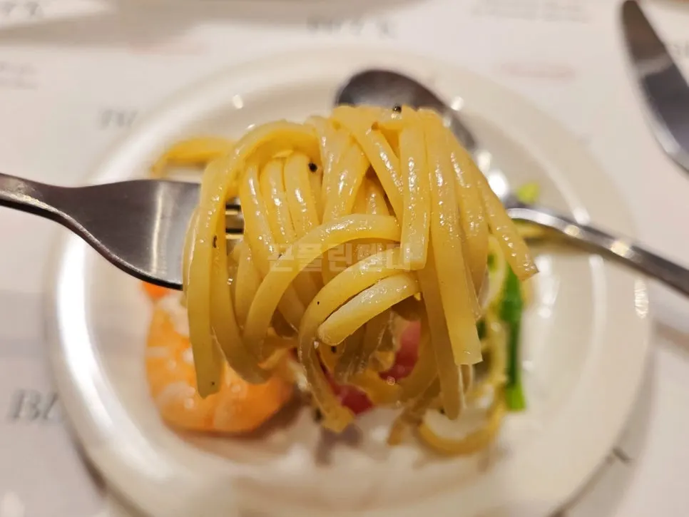 Napa cabbage topped with Caesar dressing and cheese