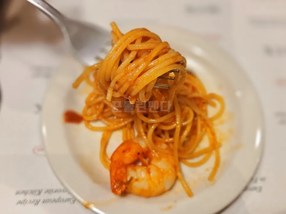 Plump cocktail shrimp on top of the pasta