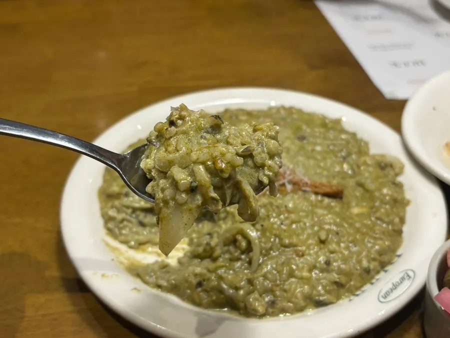 Deep-colored abalone innard cream risotto