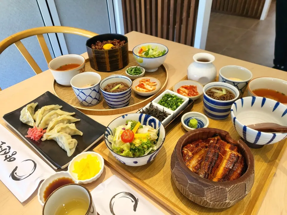 Two rice bowls set against the garden view outside the window