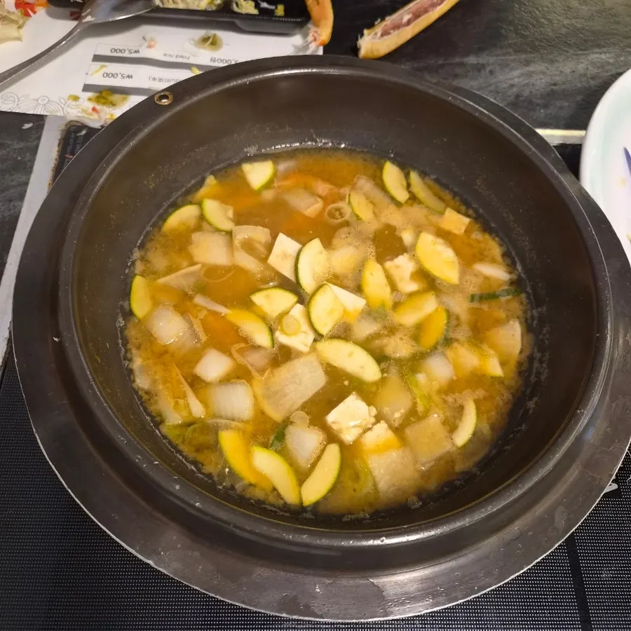 Crab-shell bibimbap and doenjang jjigae spread